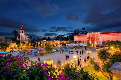 a group of people walking around a plaza at night at Events Allowed: Sunny Villa| Lake| Trails| Beach in La Mesa