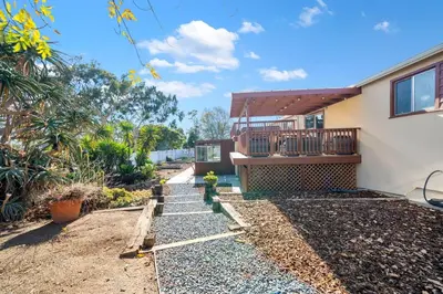 a house with a staircase leading up to a balcony at Westinghouse Park Retreat Decks, BBQ, Fire Pits in San Diego