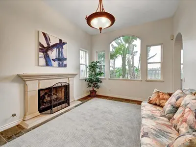 a living room with a couch and a fireplace at Luxury Gated Retreat Views Trails & Resort Pool in Carlsbad