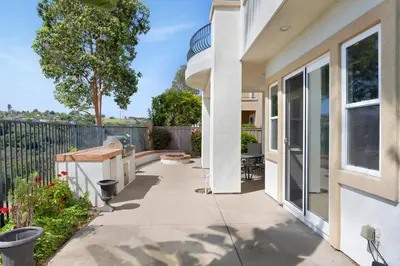 a patio of a home with a fence at Luxury Gated Retreat Views Trails & Resort Pool in Carlsbad