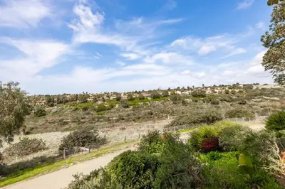 a dirt road with houses on a hill at Luxury Gated Retreat Views Trails & Resort Pool in Carlsbad