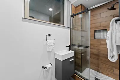 a bathroom with a sink and a shower at The Neon Elm Hotel in San Diego