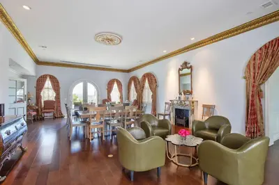 a living room with chairs and a dining room at Fountainhead Vineyards Manor in Temecula