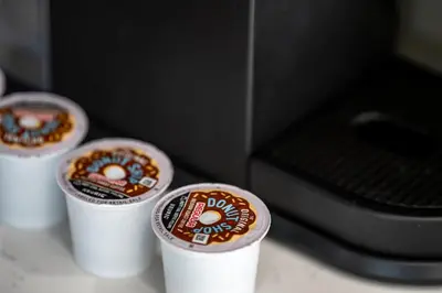 three styrofoam cups with food in front of a stove at Beautiful cozy home in San Diego in San Diego