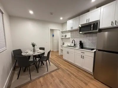 a kitchen and dining room with a table and chairs at Beautiful cozy home in San Diego in San Diego