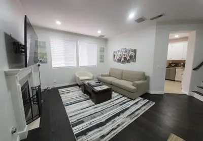 a living room with a couch and a table at Family-Friendly Sunny SD Escape, Sleeps 8, Beach, Zoo, Downtown & Convention Center in San Diego