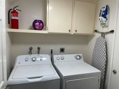 a small kitchen with a stove and a cabinet at Family-Friendly Sunny SD Escape, Sleeps 8, Beach, Zoo, Downtown & Convention Center in San Diego