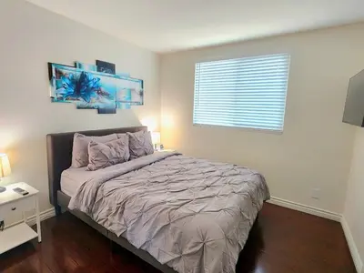 a bedroom with a bed and a window at Family-Friendly Sunny SD Escape, Sleeps 8, Beach, Zoo, Downtown & Convention Center in San Diego