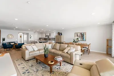 a living room with a couch and a table at The Penthouse Oceanfront in Oceanside