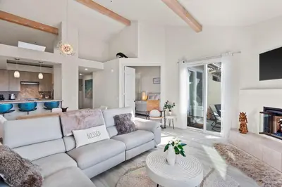 a living room with a couch and a table at Carlsbad Retreat by the Sea -30-Night Minimum in Carlsbad