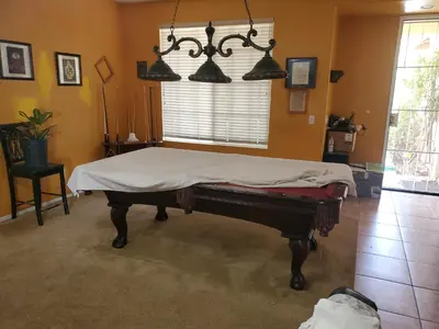 a room with a bed with a sheet on it at Galaxy House in Sun City