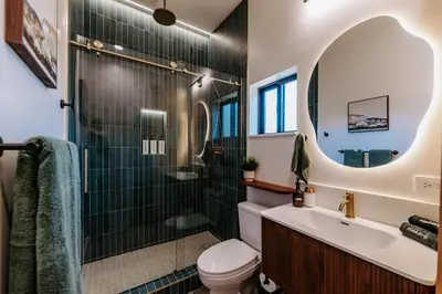 a bathroom with a shower and a toilet and a sink at Chic Casita w BBQ, Patio, Backyard - 4 min to SDSU, 15 mins to beach, Unit B in La Mesa