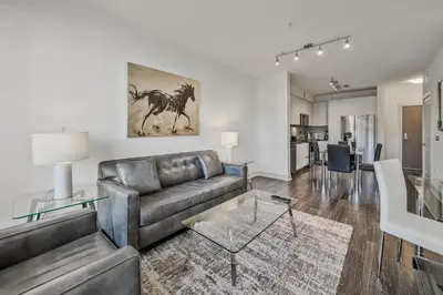 a living room with a couch and a table at Global Luxury Suites Mission Valley East in San Diego