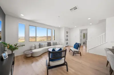 a living room with a couch and chairs and windows at #Marbella Lane - Curated 5BR in Upscale RMV Haven in Ladera Ranch