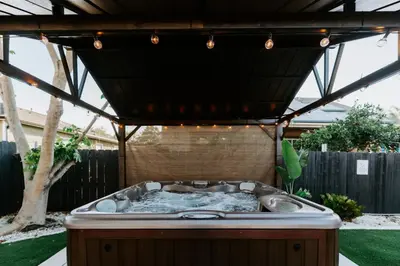 a hot tub in the middle of a backyard at Private Pool Chefs Kitchen BBQ 4min to SDSU in La Mesa