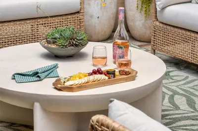 a table with a tray of food and a bottle of wine at La Jolla Hilltop Haven with Ocean Views and Spa in San Diego