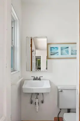 a white bathroom with a sink and a toilet at Stunning La Jolla Hideaway Close to Everything in San Diego