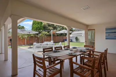 a dining room with a wooden table and chairs at Stunning La Jolla Hideaway Close to Everything in San Diego