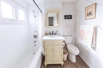 a small bathroom with a sink and a toilet at Redwood Hollow Cottages in San Diego