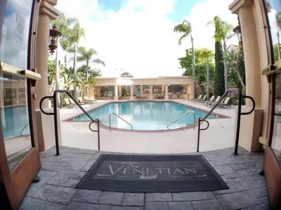 a swimming pool in a building with a sign that reads the vividian at --Vacation First floor luxury condo La Jolla, Spa, Pool, Gym in San Diego