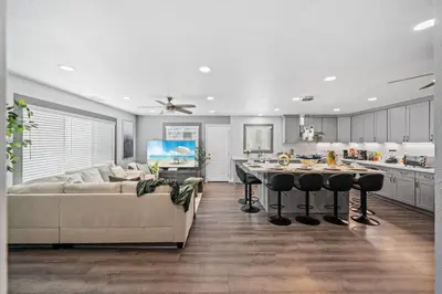 a kitchen and living room with a couch and a table at Entire Private Home with 4 Bedrooms 3 Bathrooms, King Bed, Gated Yard, Parking, Ranch, Available Now in San Diego