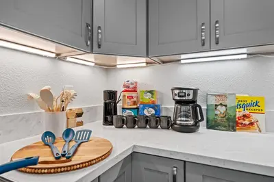 a kitchen counter with a cutting board and utensils at Entire Private Home with 4 Bedrooms 3 Bathrooms, King Bed, Gated Yard, Parking, Ranch, Available Now in San Diego