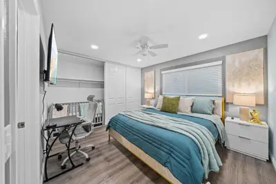 a bedroom with a bed and a desk at Entire Private Home with 4 Bedrooms 3 Bathrooms, King Bed, Gated Yard, Parking, Ranch, Available Now in San Diego
