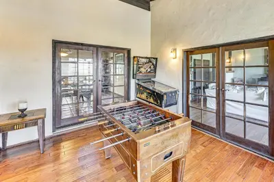 an empty room with a wine tasting room with windows at Stunning Valley and Mtn Views Elegant Temecula Home in Temecula