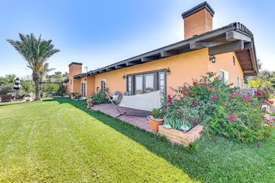 a house with a lawn in front of it at Stunning Valley and Mtn Views Elegant Temecula Home in Temecula