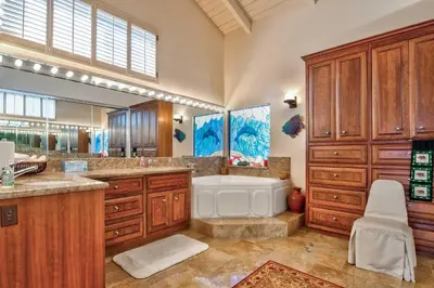 a large bathroom with a tub and a sink at Luxury Oceanfront Home- Upper in Oceanside