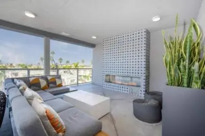 a living room with a couch and a fireplace at North Park Modern 2BR King Beds, Workspaces, Parking in San Diego