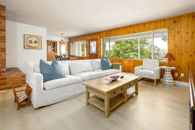 a living room with a white couch and a table at 3Bed Single Level Home in Carlsbad