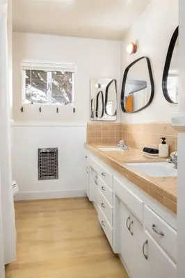 a bathroom with a sink and two mirrors at 3Bed Single Level Home in Carlsbad