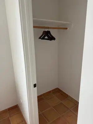 a room with a closet with two pairs of umbrellas at Private Encinitas Casita & Patio in Encinitas