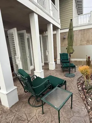a patio with chairs and an umbrella and a table at Private Encinitas Casita & Patio in Encinitas