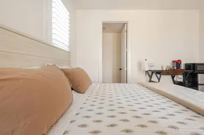 a bedroom with a bed and a rug at Private Encinitas Casita & Patio in Encinitas