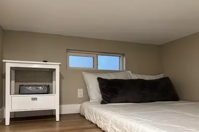 a bedroom with a bed and a tv in it at Pool and Hot Tub Access Cozy Perris Tiny Home in Perris