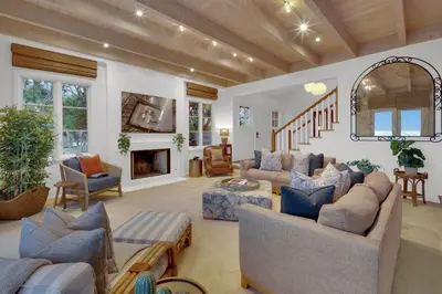 a large living room with couches and a fireplace at Fairway Retreat, Stylish Coastal Home Near Golf, Beaches & Carlsbad Fun in Encinitas