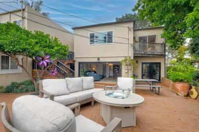 a patio with a couch and chairs and a table at Luxury Beach Duplex, Sleeps 9, Dog-Friendly, AC, Fire Pit & Grill in Carlsbad
