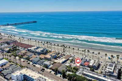 an aerial view of a beach and the ocean at Oceanside Bungalow, Walk to Beach & Pier, Private Hot Tub, Beach Gear in Oceanside