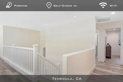 a hallway with a staircase in a home at Spacious Extended Stay Temecula in Temecula