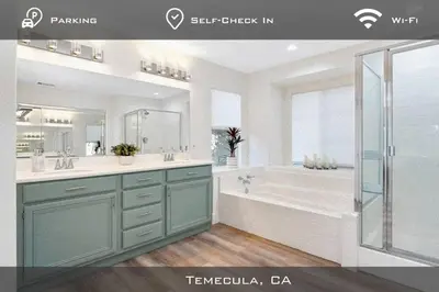 a bathroom with a tub and a sink and a shower at Spacious Extended Stay Temecula in Temecula