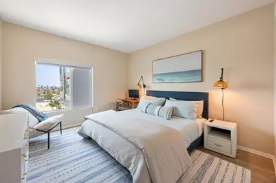 a bedroom with a bed and a window at NEW LUX Modern Retreat Views Parking Workspaces in San Diego