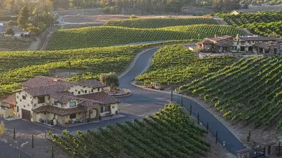 arial view of a vineyard with a house and a road at 2 Homes in Bella Vista Rd by AvantStay Sleeps 8 Vineyard Views Patios in Temecula Wine Trail in Temecula