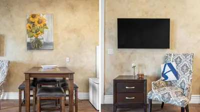 a living room with a table and a chair at New-Build Temecula Villa with King Suite Patio Vineyard Views The Villa by AvantStay in Temecula