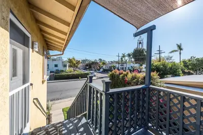 a balcony view of a street with a house at Canyon View in San Diego