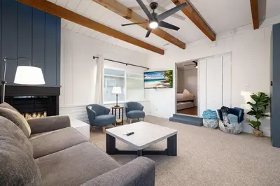 a living room with a couch and a table at Central Backyard Oasis Villa in San Diego
