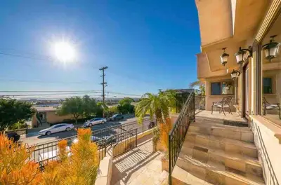 a balcony with a view of a parking lot at Stunning Views, Rooftop Vista, Pool & Spa in San Diego