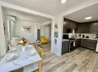 a kitchen and living room with a table and chairs at Central San Diego 2 BED Condo in San Diego