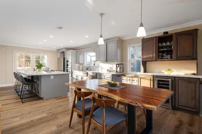 a large kitchen with a wooden table and chairs at Luxury Home OceanView in San Diego
